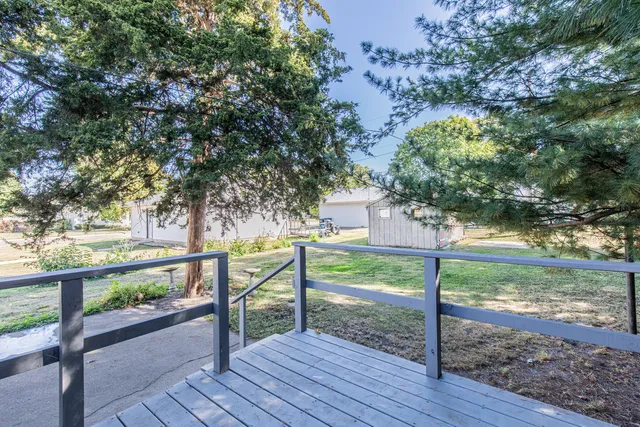 a view of a pathway with a yard