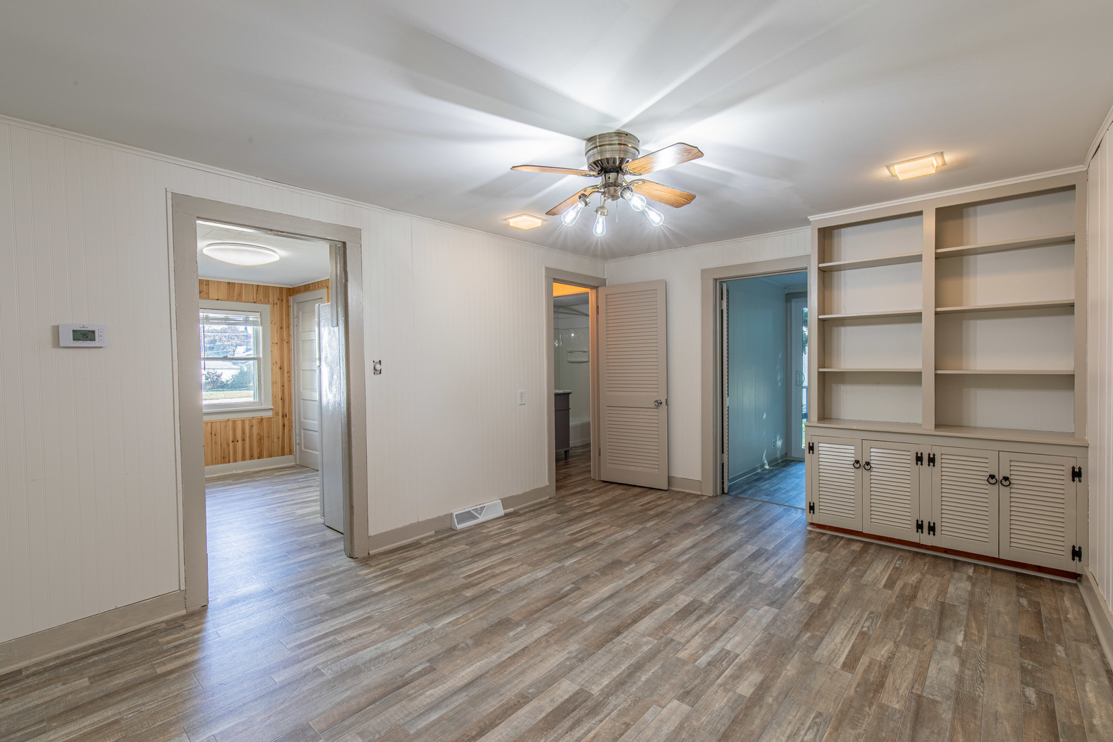 9 South Randolph Street Princeton, IL 61356 - Photo 9 of 26 wooden floor in an empty room with a window