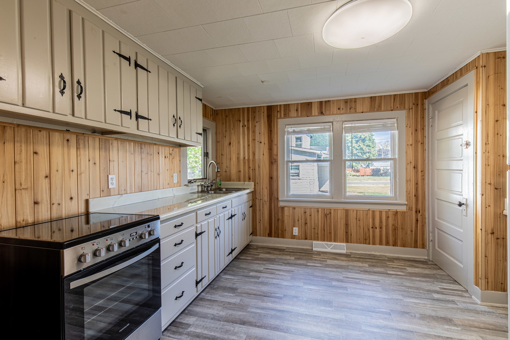 9 South Randolph Street Princeton, IL 61356 - Photo 10 of 26 a kitchen with stainless steel appliances granite countertop a stove and a sink