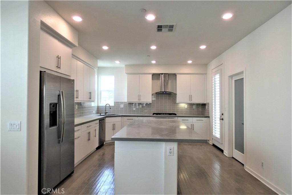 130 Acamar Irvine, CA 92618 - Photo 17 of 43 a large kitchen with stainless steel appliances lots of counter top space