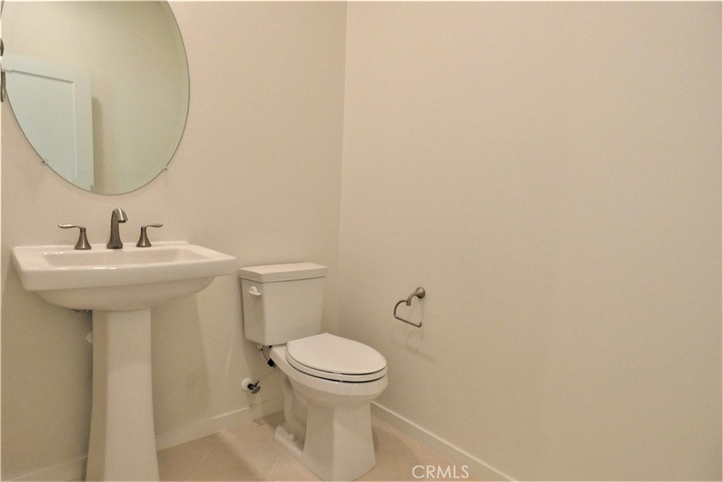 130 Acamar Irvine, CA 92618 - Photo 20 of 43 a bathroom with a sink mirror and toilet