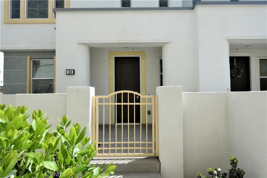 130 Acamar Irvine, CA 92618 - Photo 3 of 43 a front view of a house with plants