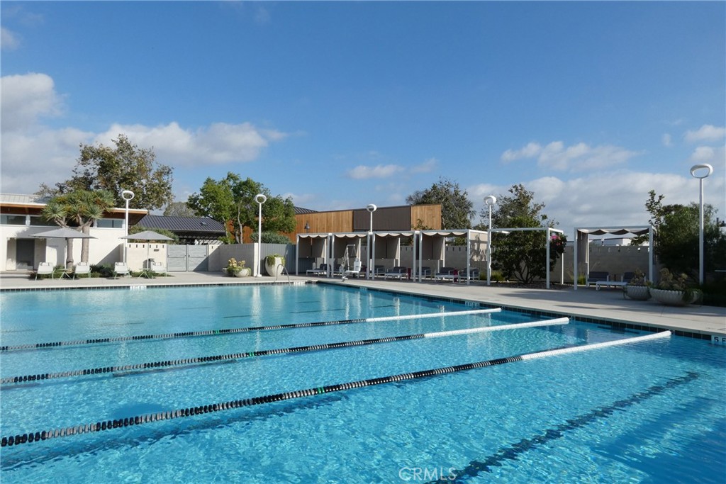 130 Acamar Irvine, CA 92618 - Photo 35 of 43 a view of a swimming pool with a lawn chairs