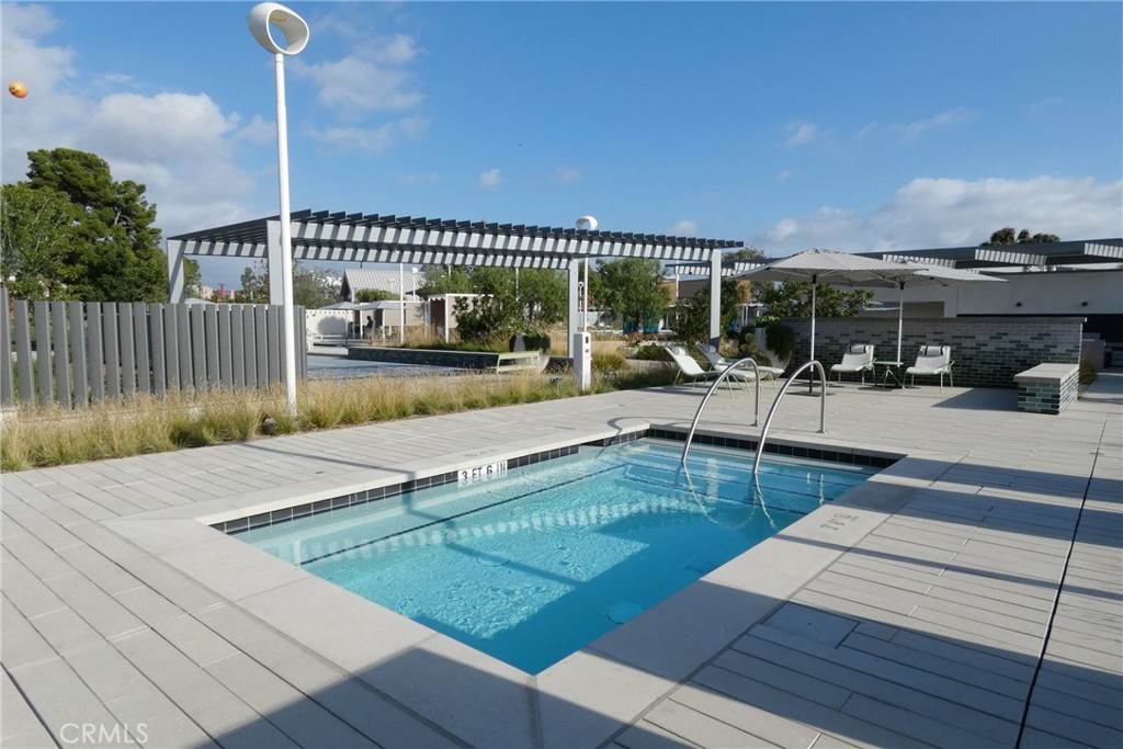 130 Acamar Irvine, CA 92618 - Photo 37 of 43 a view of a patio with dining table and chairs with wooden floor