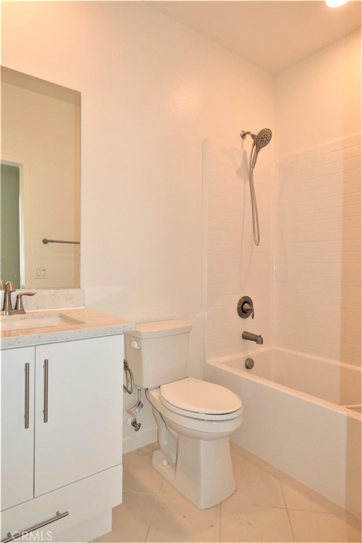 130 Acamar Irvine, CA 92618 - Photo 6 of 43 a bathroom with a toilet sink a mirror and shower