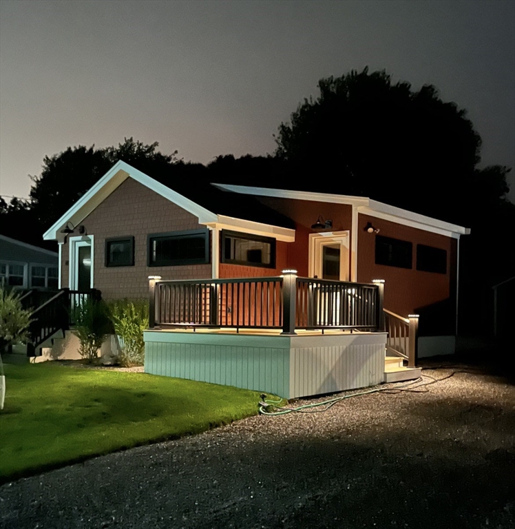 41 Point Street Fairhaven, MA 02719 - Photo 24 of 25 a front view of a house with a yard and trees