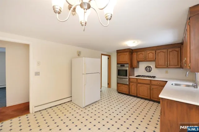 a kitchen with a refrigerator a sink and dishwasher
