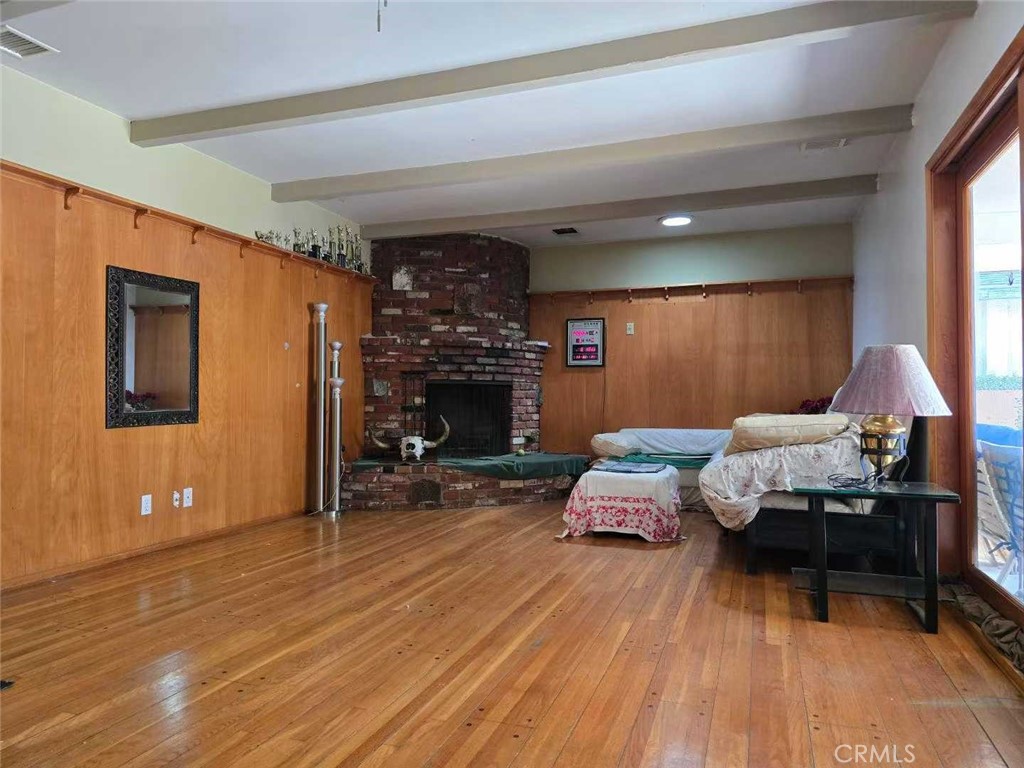 504 Sharon Road Arcadia, CA 91007 - Photo 5 of 6 a bedroom with furniture and a wooden floor