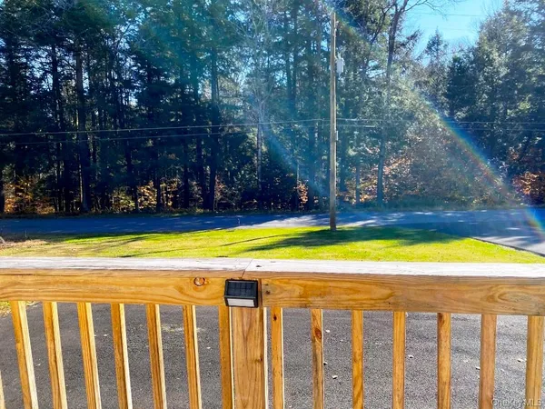 a view of a yard with a tree