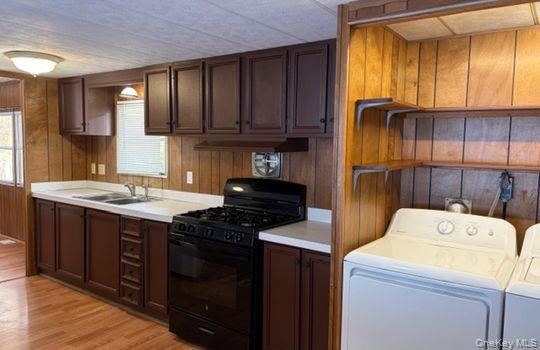 141 Gale Road Mongaup Valley, NY 12762 - Photo 9 of 20 a kitchen with a stove cabinets and a sink