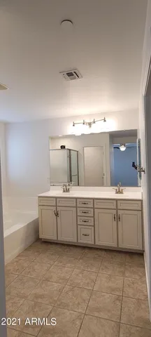 a kitchen with sink and cabinets