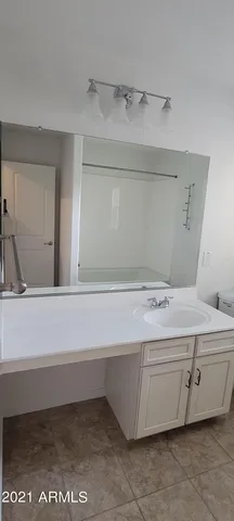 a bathroom with a bathtub and a sink
