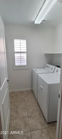 a utility room with a sink a washer and dryer