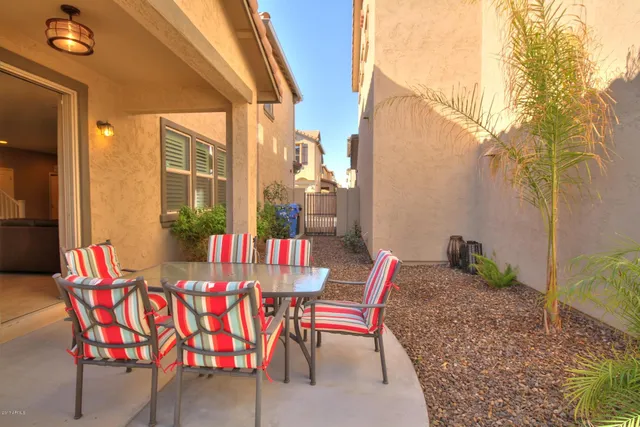 a outdoor space with patio the couches and a potted plant on a table