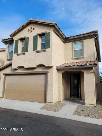 a front view of a house with a garage