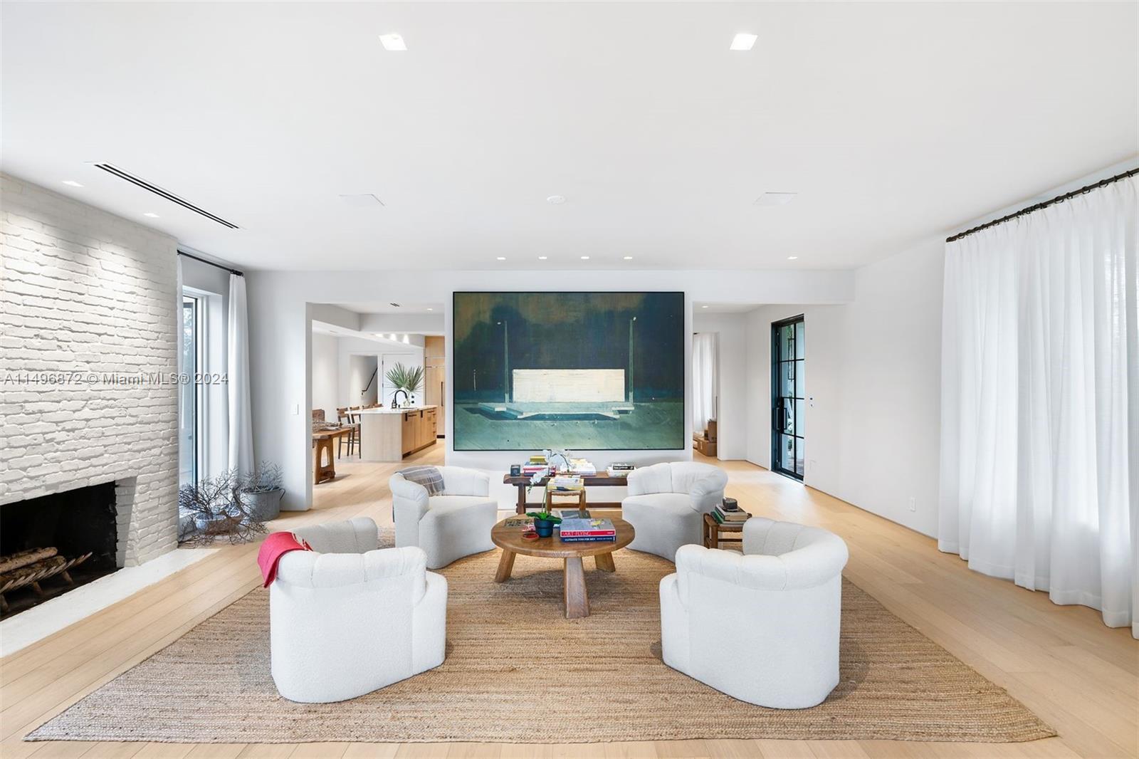 2770 Sunset Drive Miami Beach, FL 33140 - Photo 12 of 56 a living room with furniture and a fireplace