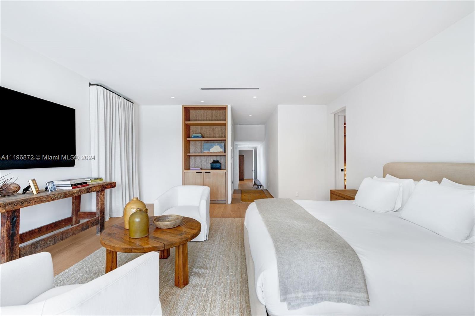 2770 Sunset Drive Miami Beach, FL 33140 - Photo 19 of 56 a living room with furniture and a flat screen tv