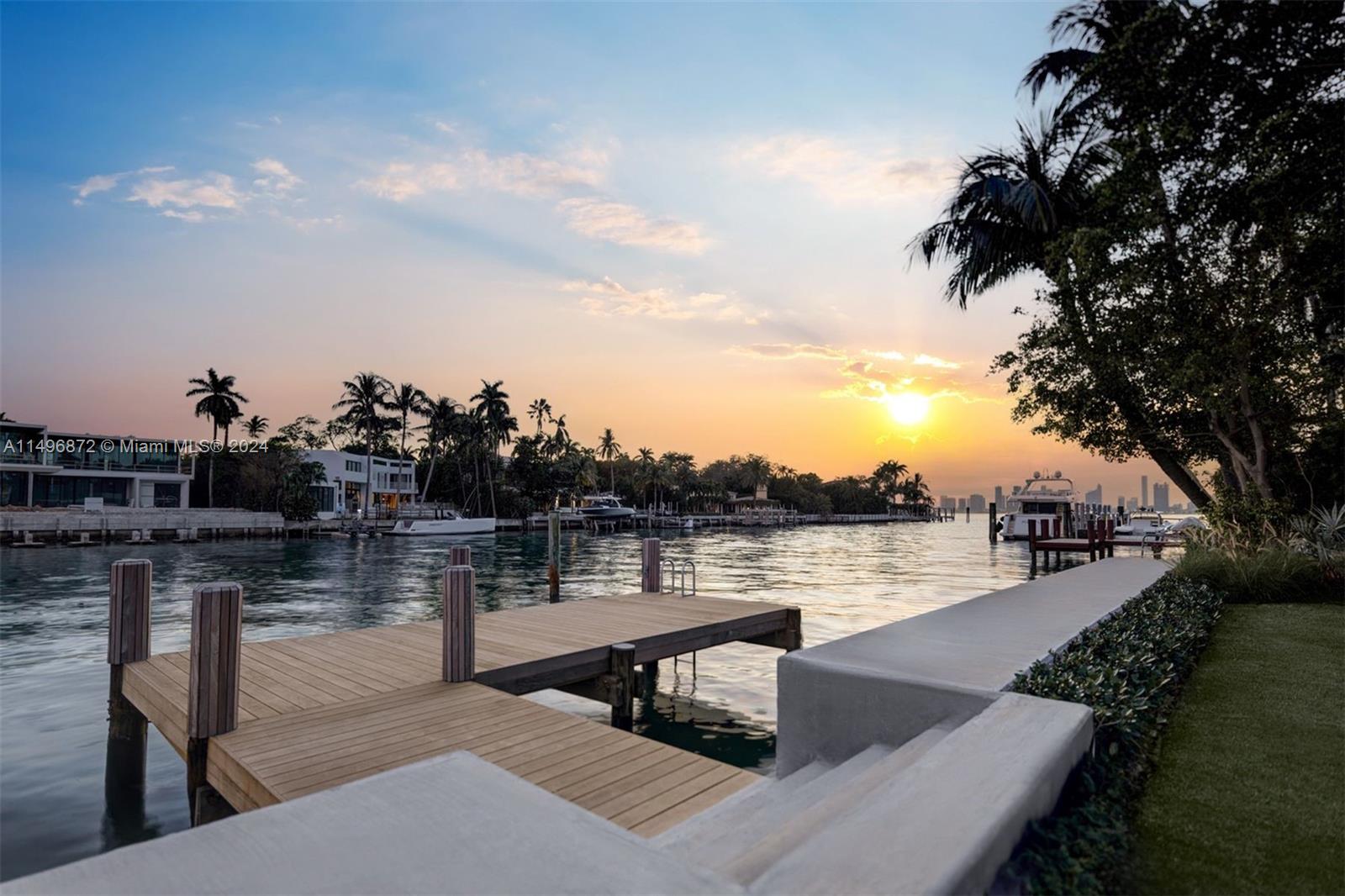 2770 Sunset Drive Miami Beach, FL 33140 - Photo 2 of 56 a lake view with tables and chairs and a dining table and chair with lake view