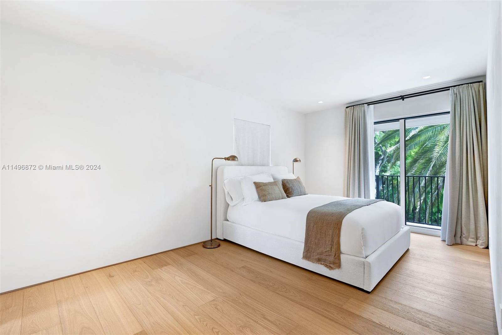 2770 Sunset Drive Miami Beach, FL 33140 - Photo 29 of 56 a room with a bed and a large window