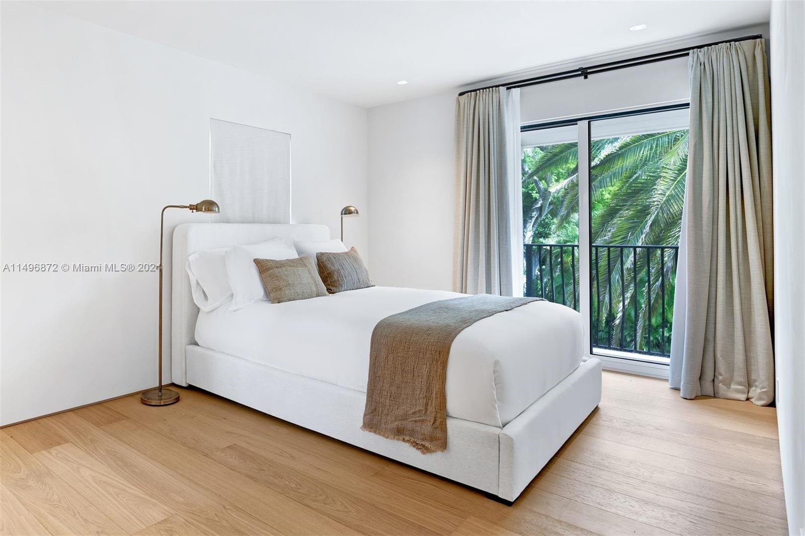 2770 Sunset Drive Miami Beach, FL 33140 - Photo 30 of 56 a bedroom with a bed and large window