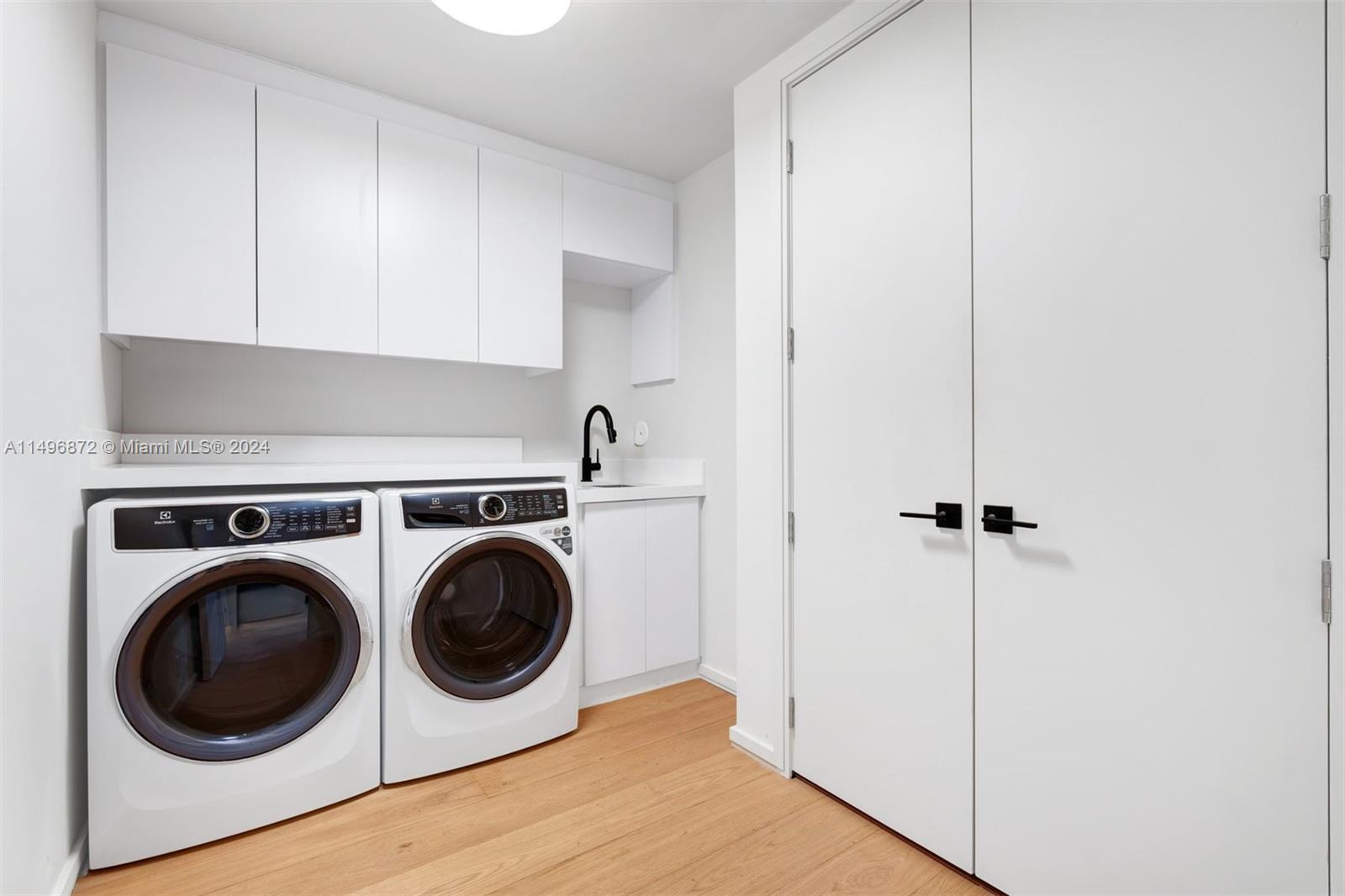 2770 Sunset Drive Miami Beach, FL 33140 - Photo 37 of 56 a utility room with dryer and washer