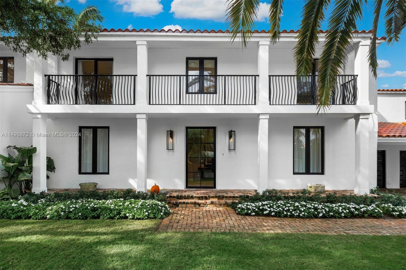 2770 Sunset Drive Miami Beach, FL 33140 - Photo 38 of 56 front view of a house with a yard