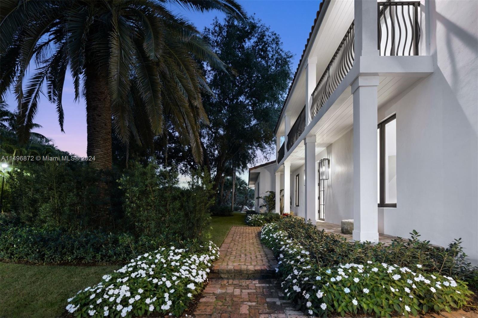 2770 Sunset Drive Miami Beach, FL 33140 - Photo 40 of 56 a view of backyard with potted plants and large tree