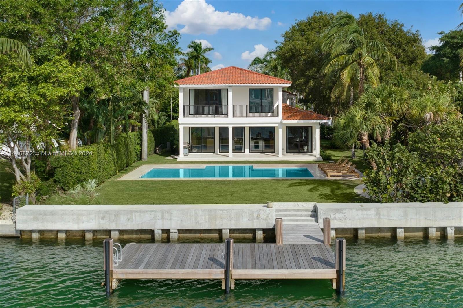 2770 Sunset Drive Miami Beach, FL 33140 - Photo 42 of 56 a front view of a house with a yard