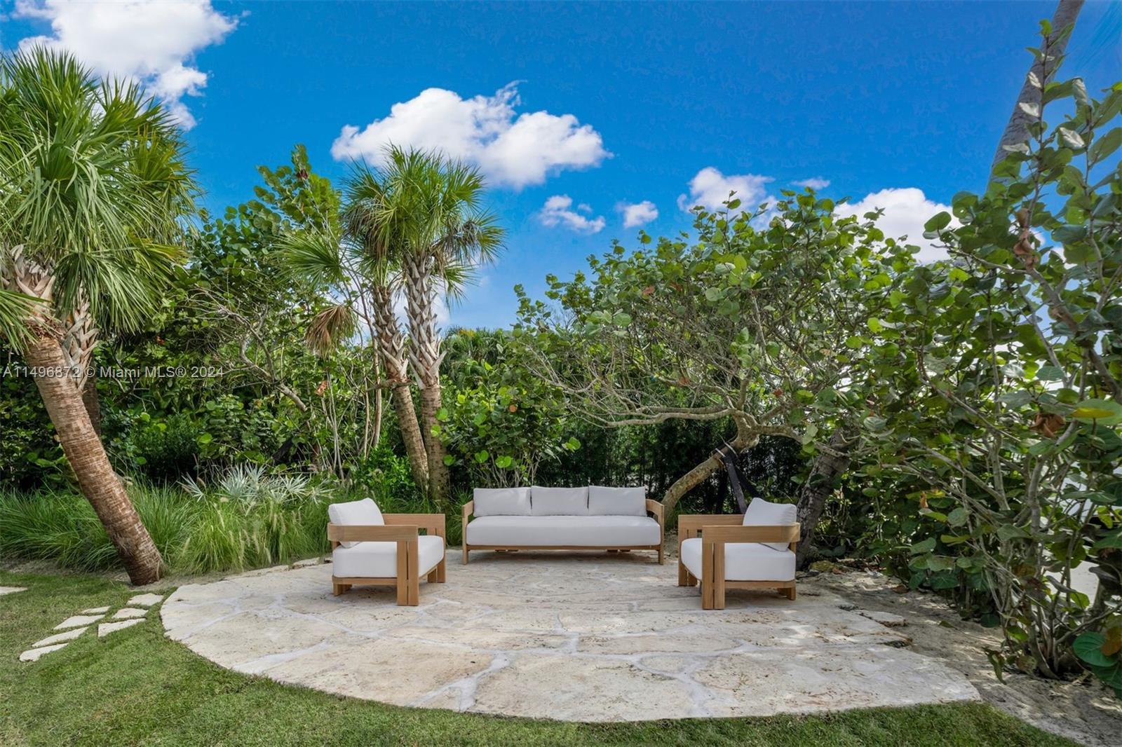 2770 Sunset Drive Miami Beach, FL 33140 - Photo 56 of 56 a view of a bench in the garden