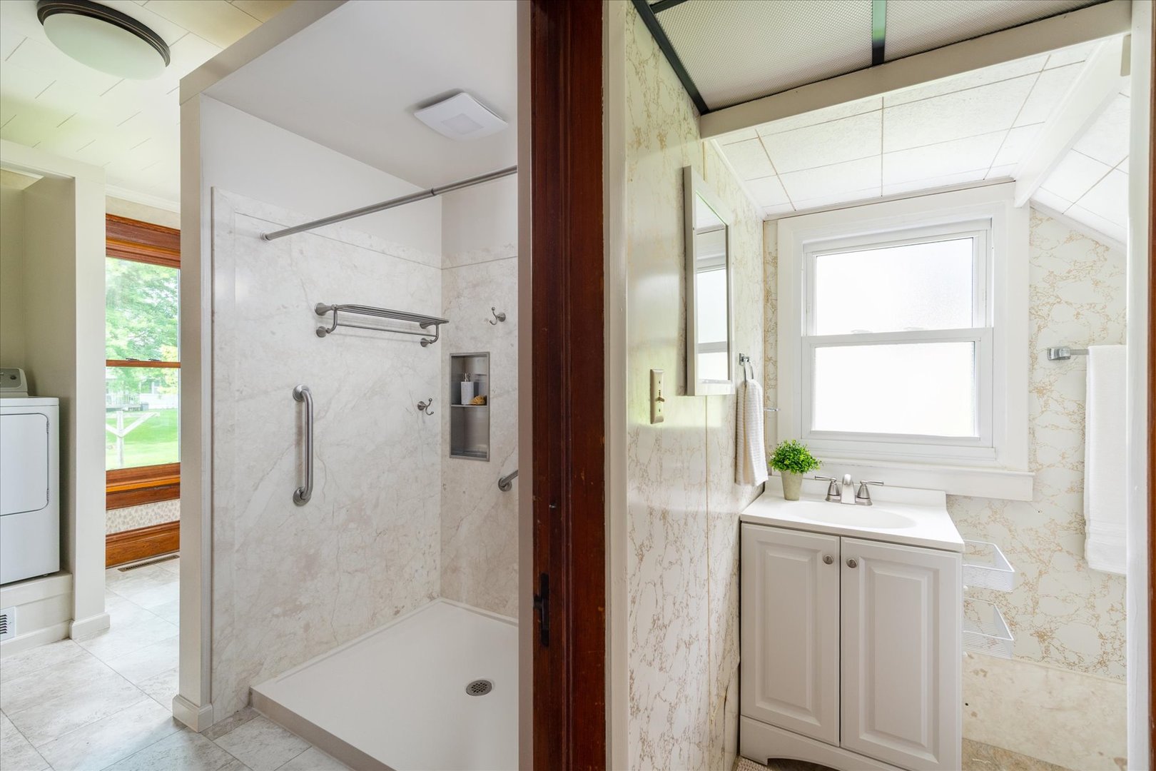 443 East Peru Street Princeton, IL 61356 - Photo 13 of 44 a bathroom with a granite countertop sink a shower and a mirror