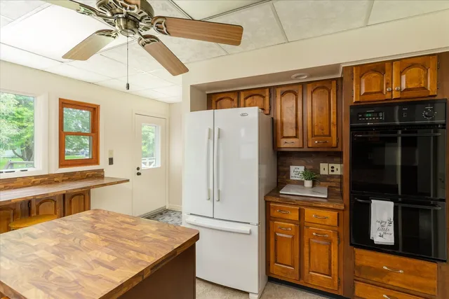 a kitchen that has a sink and a stove in it