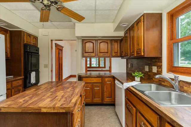 a kitchen with a stove a sink and a refrigerator