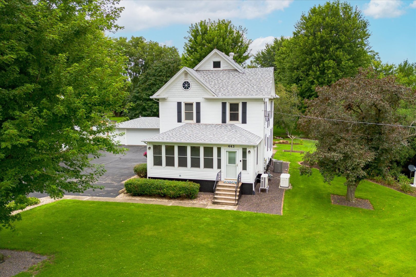 443 East Peru Street Princeton, IL 61356 - Photo 2 of 44 a aerial view of a house with a yard table and chairs
