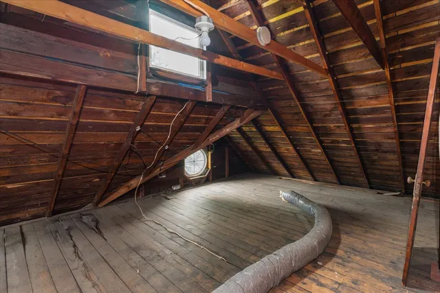a view of backyard with a table and chairs