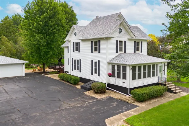 a view of a house with a yard and plants