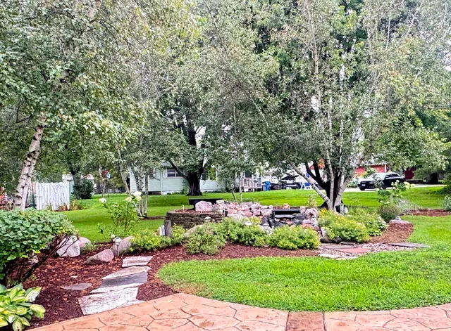 a garden view with a sitting space