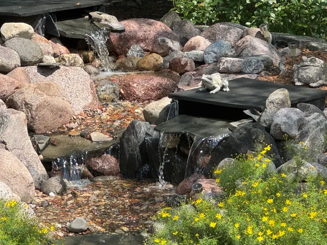 a view of a lake with open water fountain