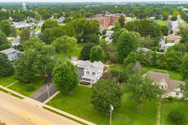 an aerial view of a house with a yard