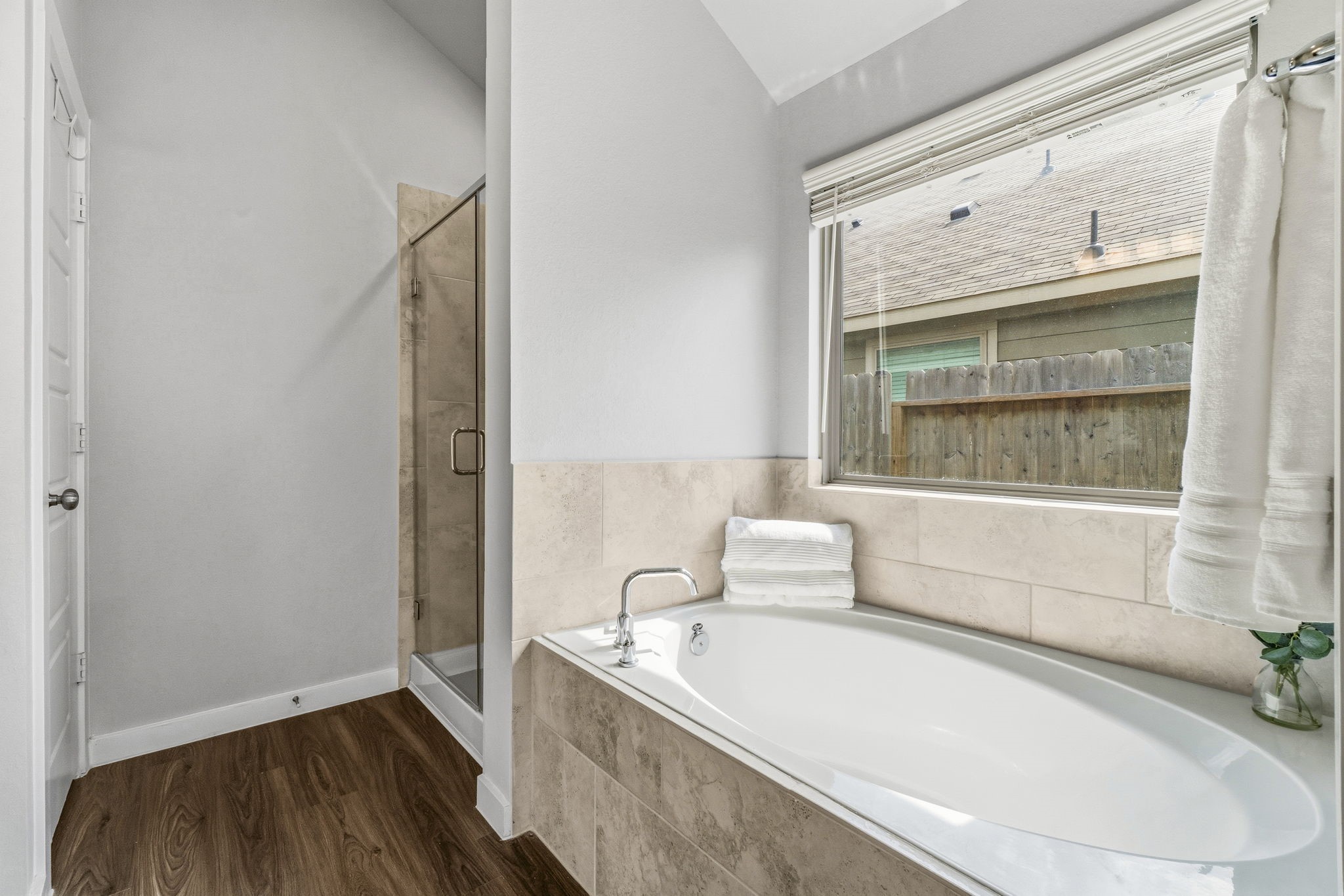 22235 Cardinal Crest Lane New Caney, TX 77357 - Photo 17 of 41 Spacious primary bathroom featuring a relaxing soaking tub, a separate glass-enclosed shower, dual vanities,