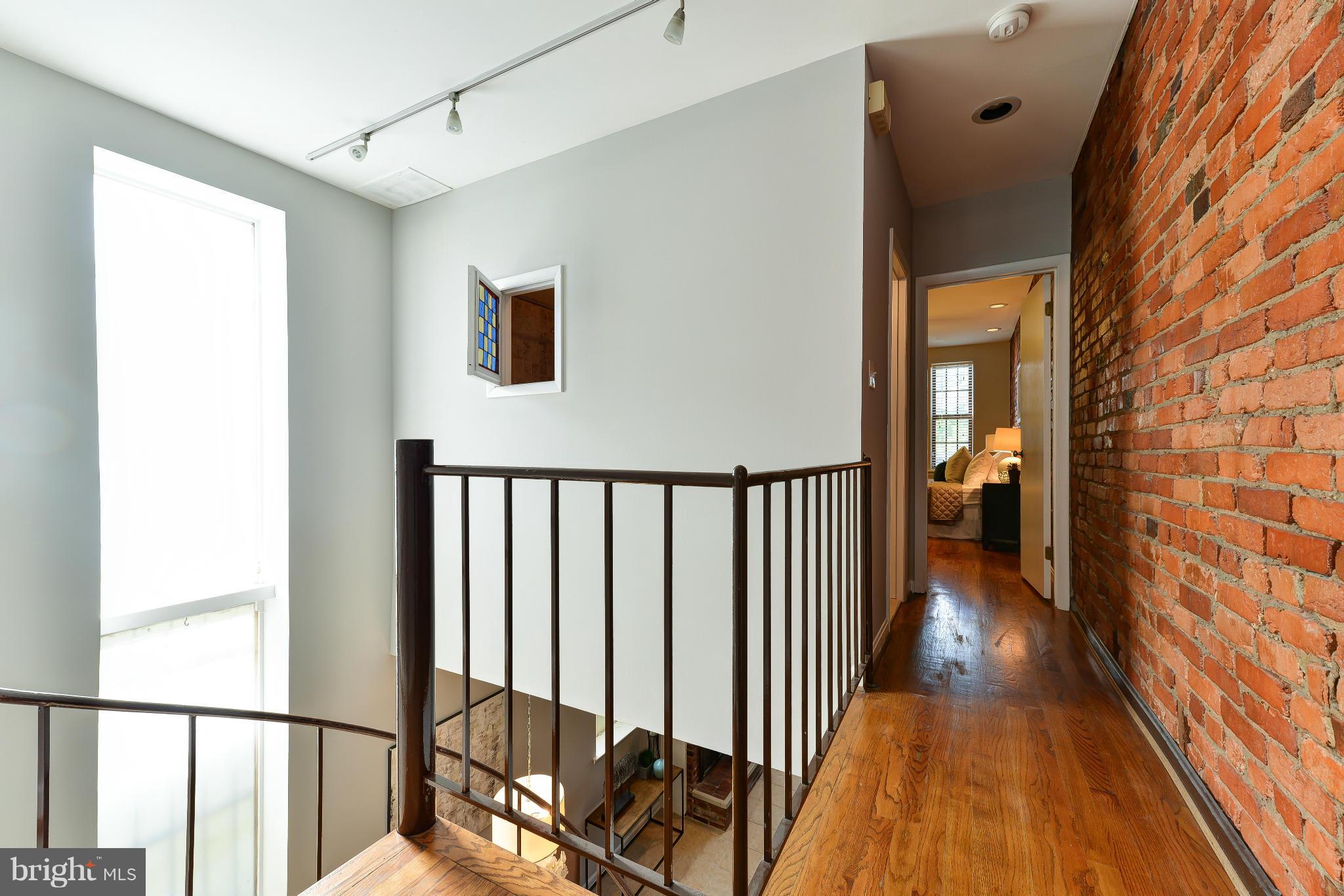 1243 Linden Place Northeast Washington, DC 20002 - Photo 15 of 30 a view of a hallway with wooden floor and stairs
