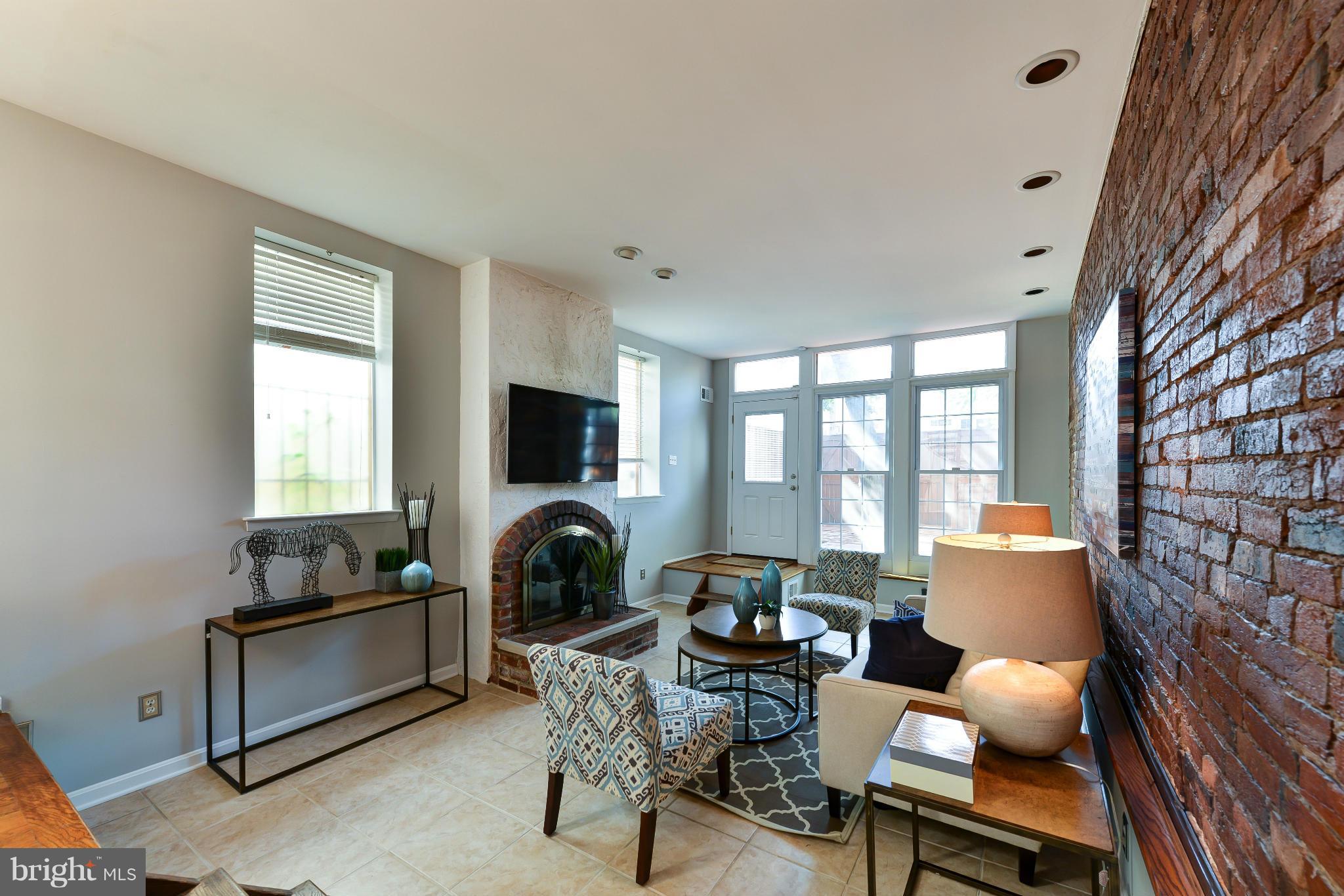 1243 Linden Place Northeast Washington, DC 20002 - Photo 3 of 30 a living room with furniture and a window