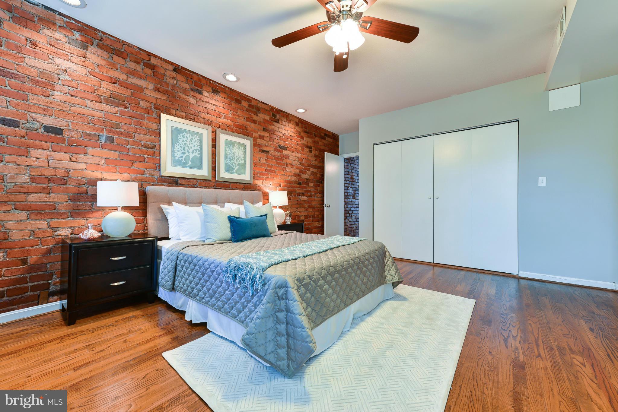 1243 Linden Place Northeast Washington, DC 20002 - Photo 21 of 30 a bedroom with a bed and wooden floor
