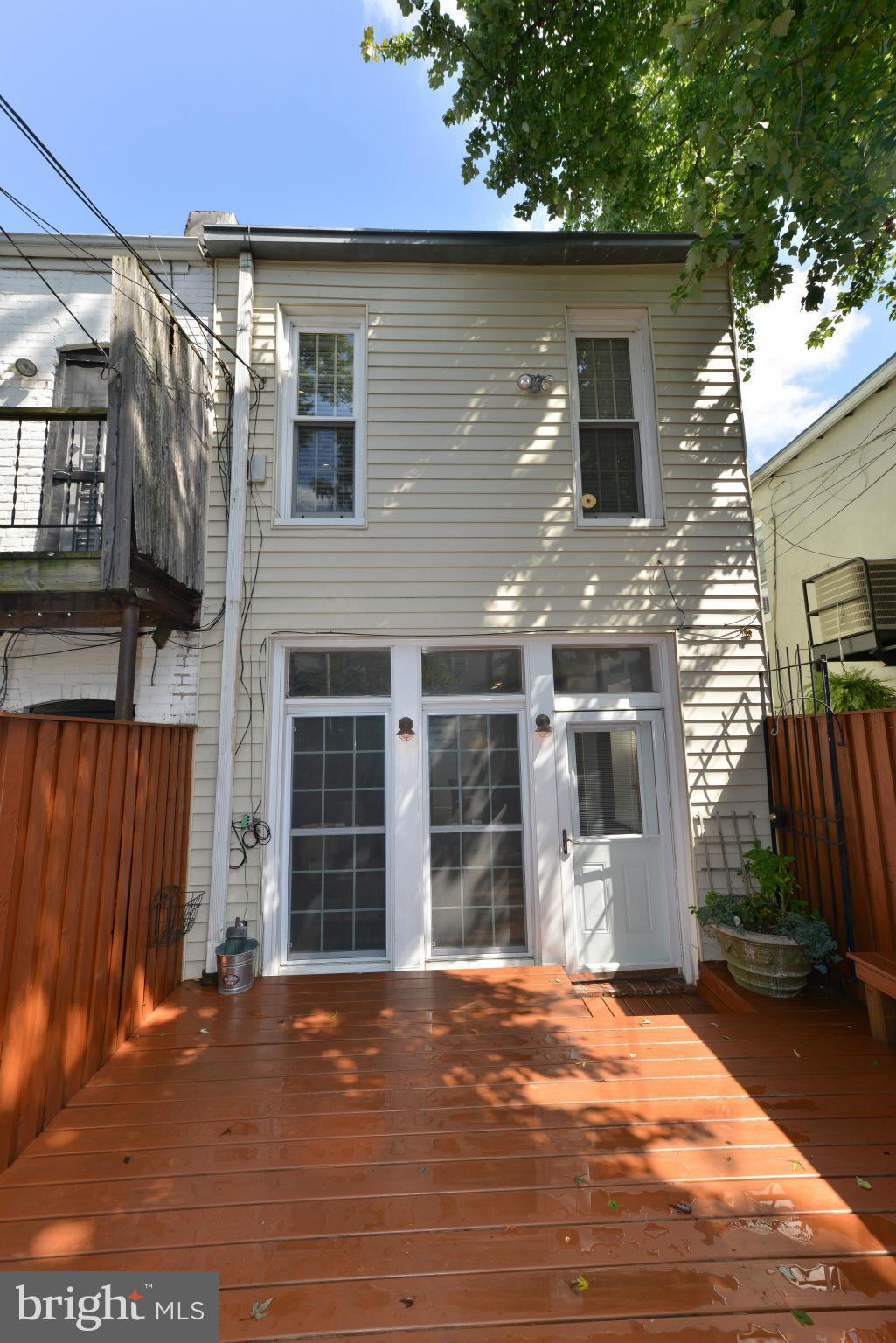 1243 Linden Place Northeast Washington, DC 20002 - Photo 22 of 30 a view of a house with a yard