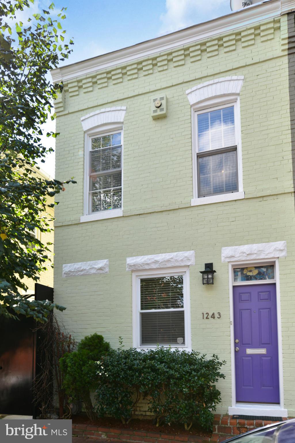 1243 Linden Place Northeast Washington, DC 20002 - Photo 23 of 30 a front view of a house with a yard