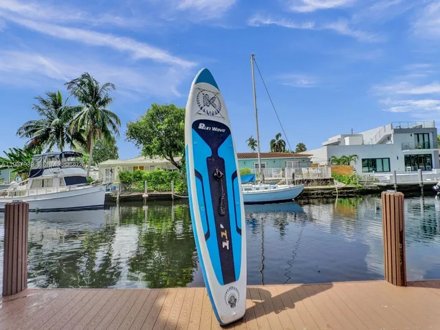 a view of a lake with a house in the background