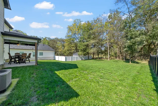 an aerial view of residential house with outdoor space and swimming pool