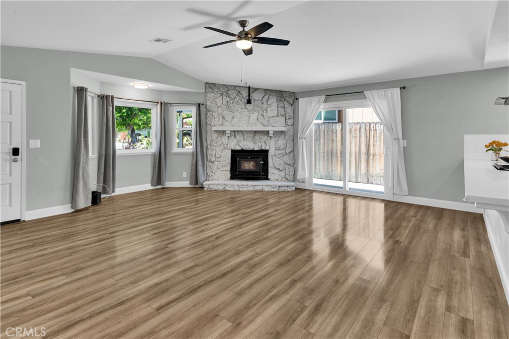 2622 Pinto Lane Paso Robles, CA 93446 - Photo 5 of 22 a view of an empty room with wooden floor fireplace and a window