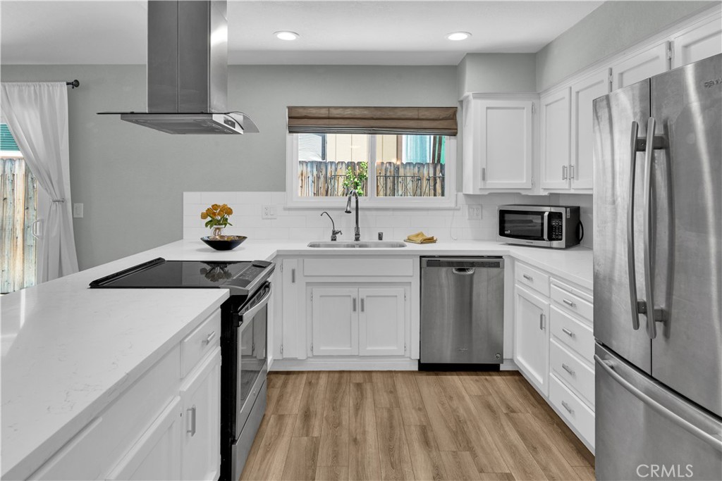 2622 Pinto Lane Paso Robles, CA 93446 - Photo 6 of 22 a kitchen with stainless steel appliances granite countertop a sink stove and refrigerator