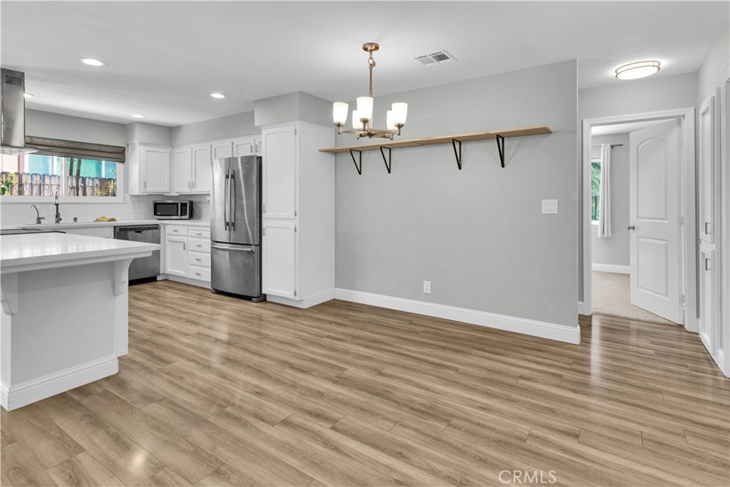 2622 Pinto Lane Paso Robles, CA 93446 - Photo 8 of 22 a view of a kitchen with refrigerator and a dishwasher