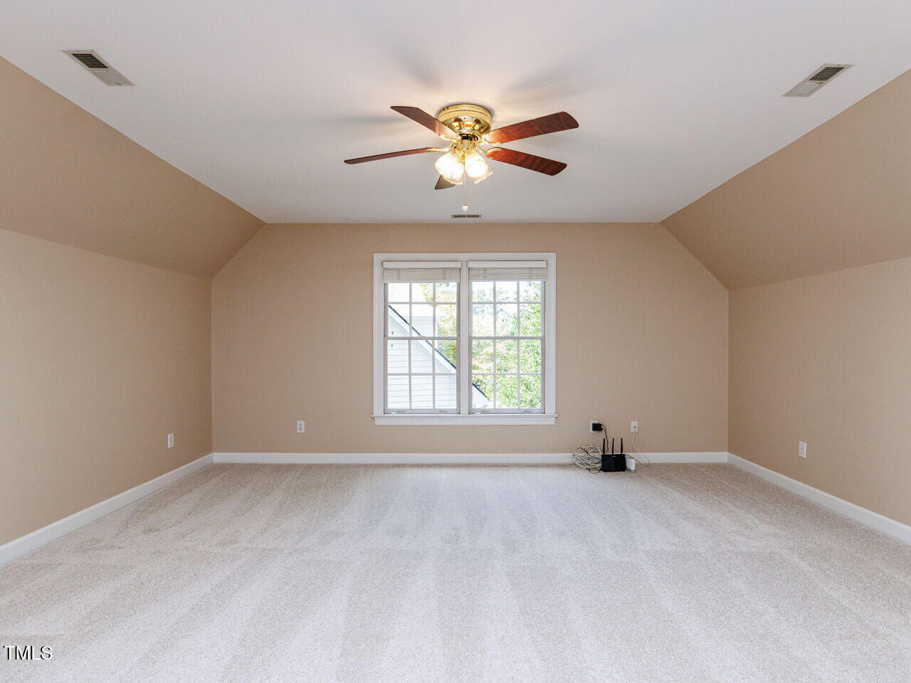 4613 Wee Burn Trail Raleigh, NC 27612 - Photo 38 of 49 Fantastic spacious bonus room with ceiling fan, new carpet and 2 access doors to the attic.